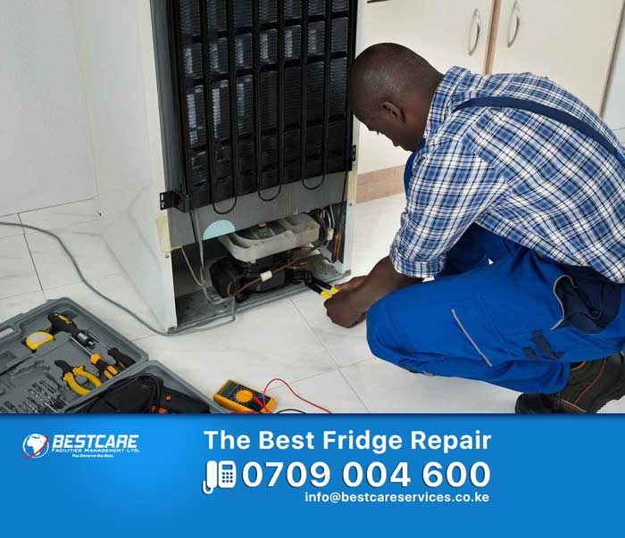Bestcare engineer checking the compressor of a refrigerator in Nairobi
